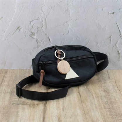 circle wood tag on bag zipper